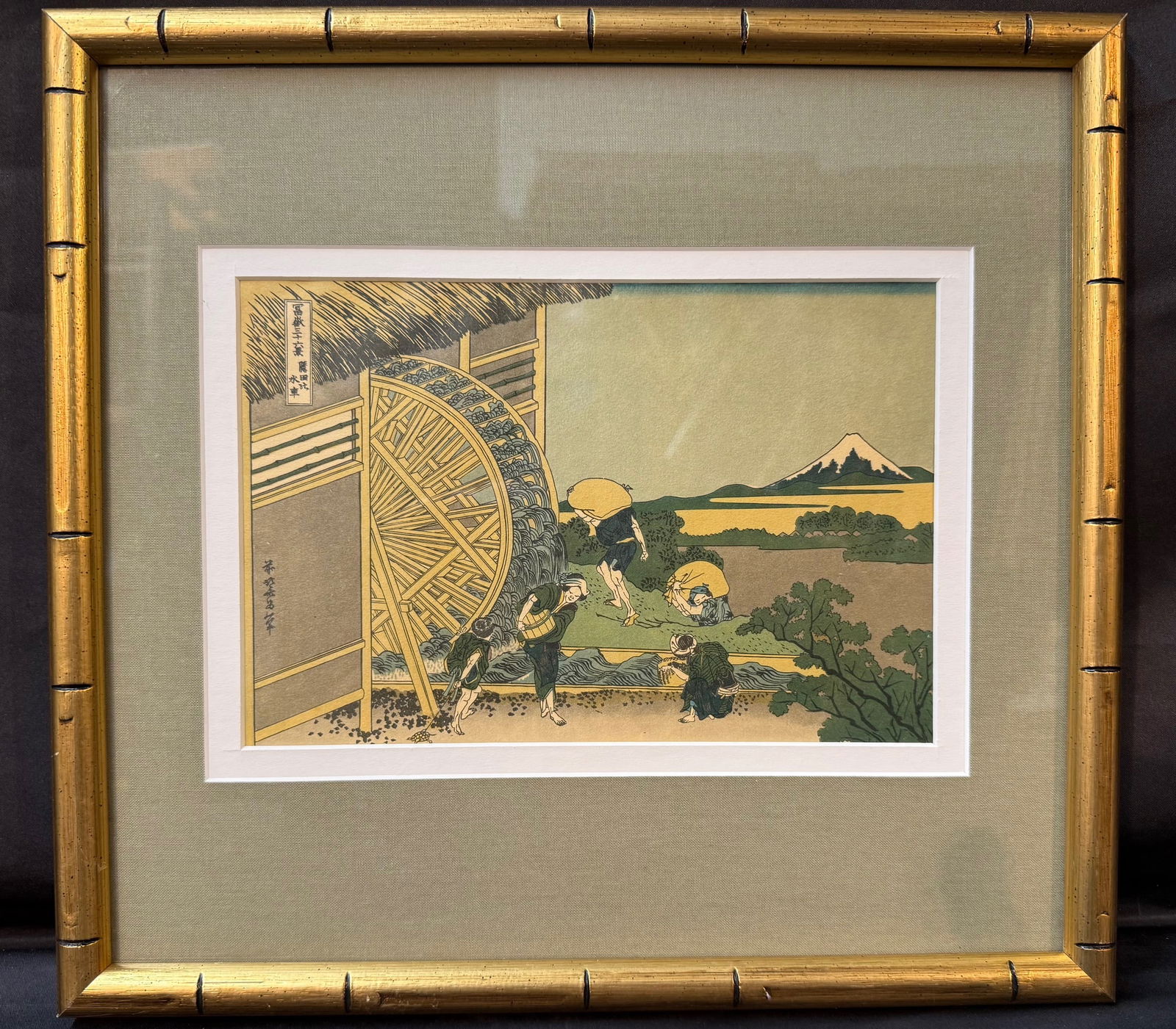 ANTIQUE JAPANESE WOODBLOCK PRINT BY KATSUSHIKA HOKUSAI (1760-1849) TITLED WATERMILL AT ONDEN, 13.5IN: A classic Japanese ukiyo-e woodblock print by Katsushika Hokusai depicting Waterwheel at Onden, one of the celebrated designs from the landmark series Thirty-Six Views of Mount Fuji. This appears to b