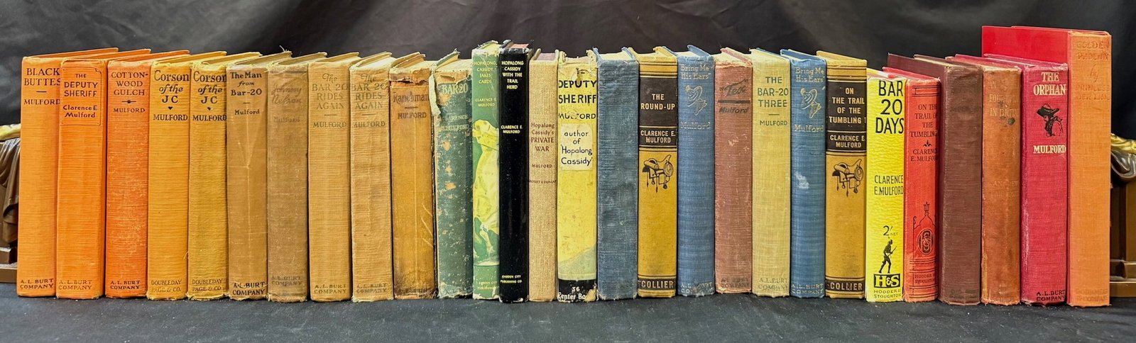 CLARENCE E. MULFORD WESTERNS BOOK SET, 28 VOLUMES, 1907-1950: 1907-1950. A set of American Western fiction books by Clarence E. Mulford, by several different publishers. All volumes in Very Good+ to Very Good condition, with the oldest book being published in 19
