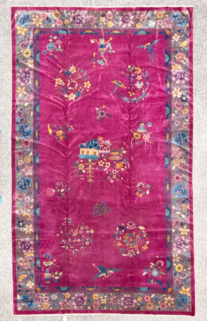 MANSION ANTIQUE CHINESE NICHOLS ART DECO HAND-KNOTTED RUG, MAGENTA FIELD, 1920S, 10.11 x 18.6 (333cm: A striking example of an early 20th century, mansion sized, Chinese Art Deco, Nichols style carpet, defined by its expansive magenta field and restrained botanical composition. This rug has medium woo