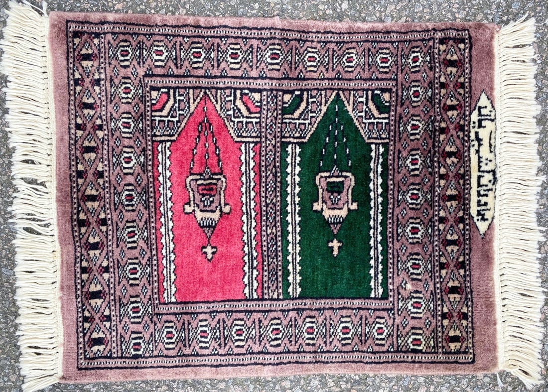 SIGNED BUKHARA TURKMEN PRAYER HAND KNOTTED RUG – 18IN x 22IN: Signed Bukhara Turkmen prayer rug was hand knotted in Pakistan of 100% natural wool on a cotton foundation. This rug has medium, even, wool piles and is in like new condition. The artist’s name has 