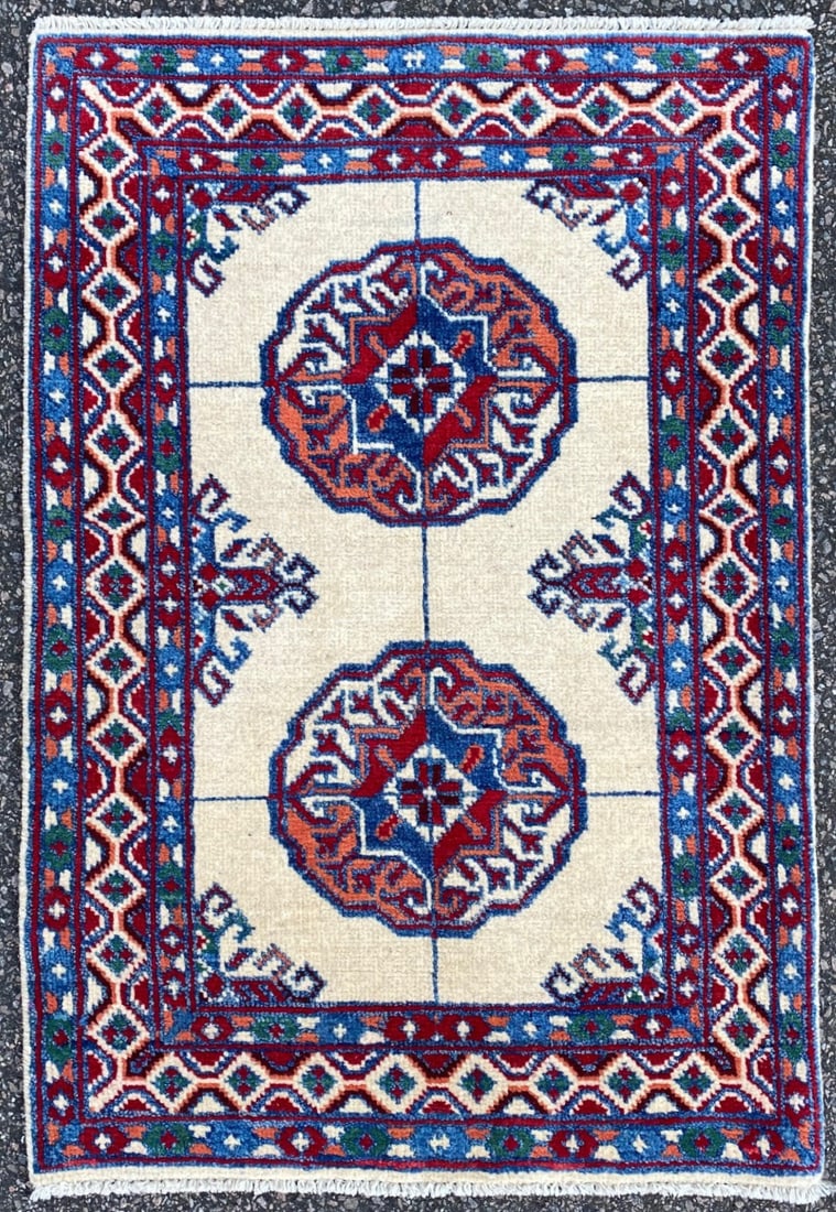 BUKHARA HAND KNOTTED RUG, 2.0 x 2.11 (61cm x 89cm): Bukhara Tekke rug was hand knotted in Pakistan of 100% natural wool on a cotton foundation. This rug is 10+ years old, has full wool piles and is in like new condition. Beautiful colors with excellent
