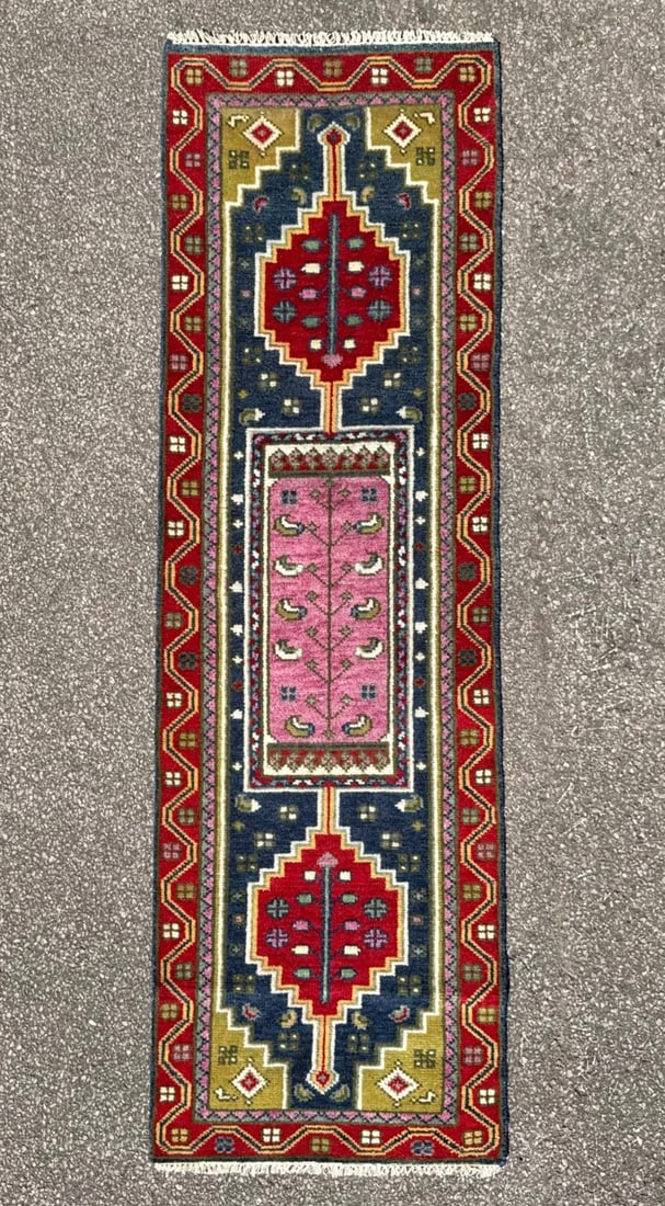 KAZAK CAUCASIAN HAND KNOTTED RUNNER, NEW, 2.6 x 8.0 (76cm x 244cm): A brand-new Caucasian Kazak runner was hand knotted in Turkey and is distinguished by its rare and highly decorative pink central field, framed within a bold geometric composition rooted in traditiona