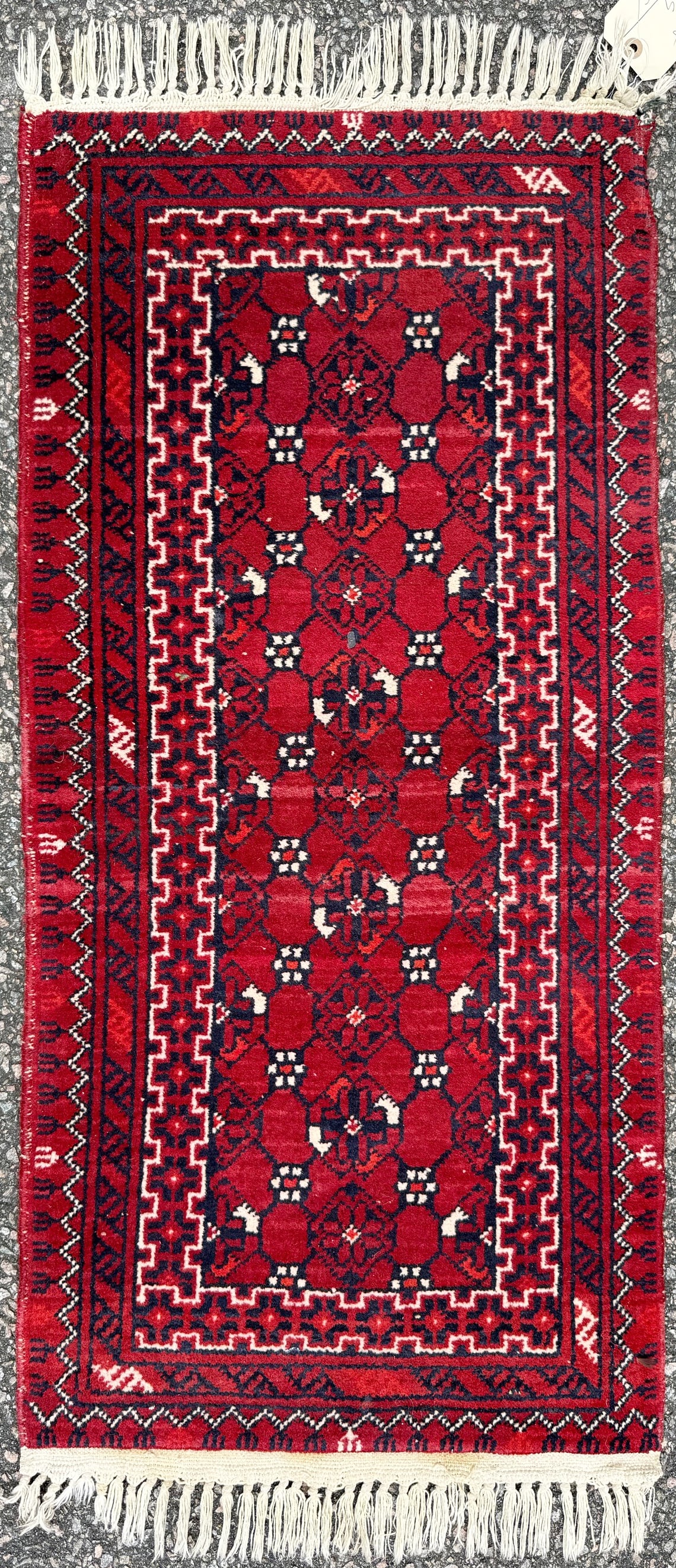 PERSIAN TRIBAL BALOUCH HAND KNOTTED SCATTER RUG, 1.6 x 3.3 (46cm x 99cm): A Persian Balouch rug was hand knotted in Persia of 100% natural wool on a cotton foundation. It has full wool piles and is in like new condition. This striking Persian Balouch tribal rug featuring a 