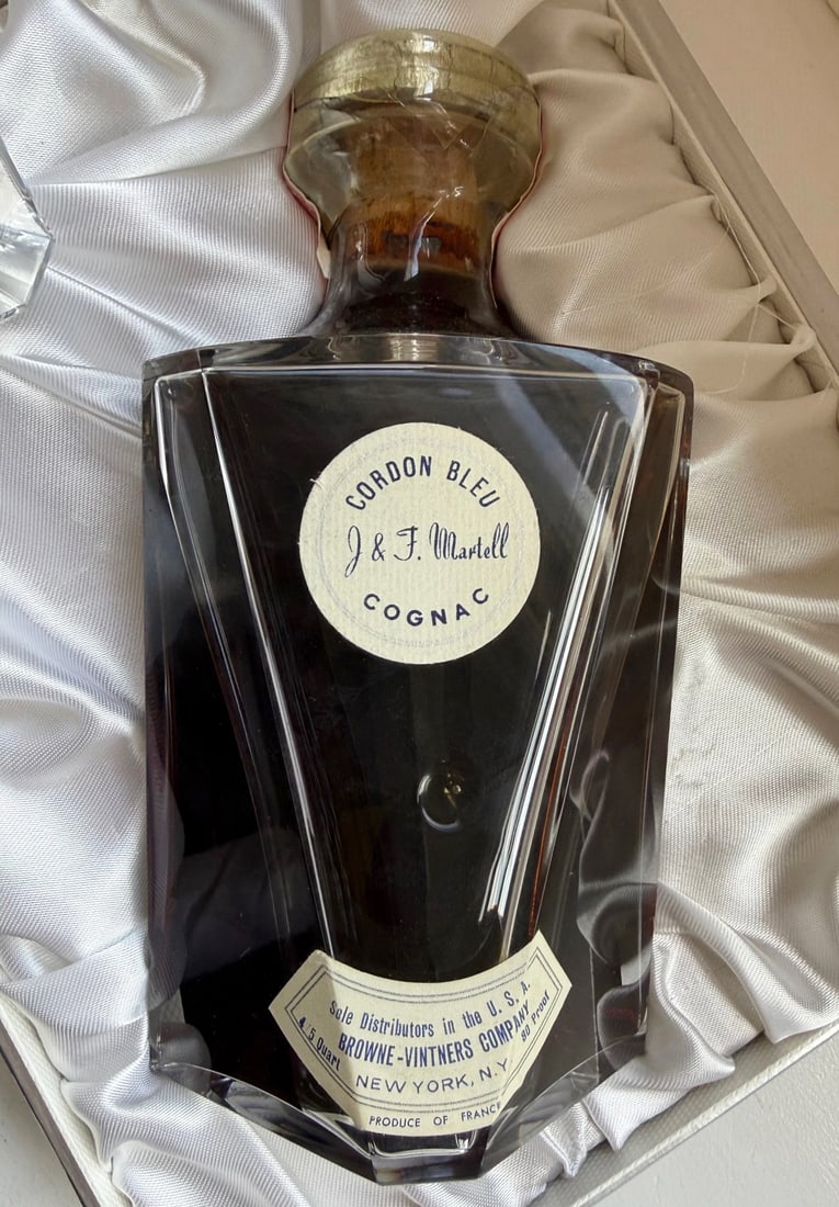 VINTAGE MARTELL “CORDON BLEU?? COGNAC IN CRYSTAL PRESENTATION DECANTER — PROPERTY FROM THE: Property from the estate of Pierre Chambrin , Executive Chef to multiple U.S. Presidents (1989-1994), this mid-century Martell Cordon Bleu cognac was retained within his personal cellar and preserved 