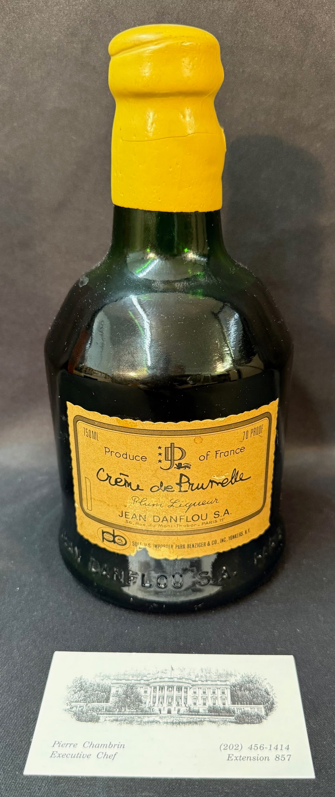 VINTAGE FRENCH CRÈME DE PRUNELLE LIQUEUR, JEAN DANFLOU, PARIS, FROM WHITE HOUSE CHEF PIERRE: A rare and highly evocative mid-20th century bottle of Crème de Prunelle (Plum Liqueur) produced by Jean Danflou S.A., Paris, and originating from the estate of Pierre Chambrin, longtime Executive Ch