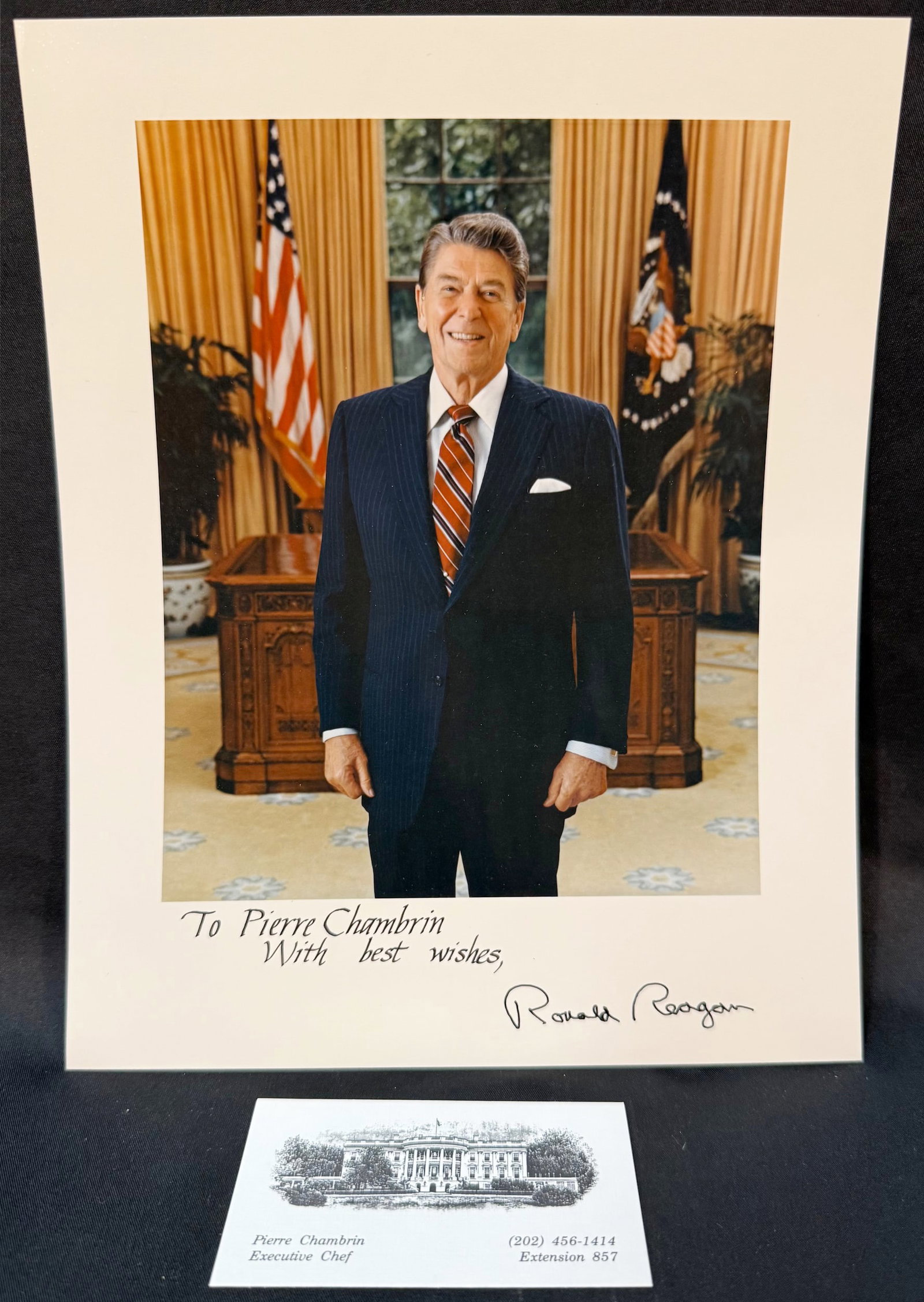 RONALD REAGAN SIGNED WHITE HOUSE PRESENTATION PHOTOGRAPH: A striking and highly collectible hand-signed presidential presentation photograph of Ronald Reagan, personally inscribed; “To Pierre Chambrin, With best wishes,” Ronald Reagan. This is not a 