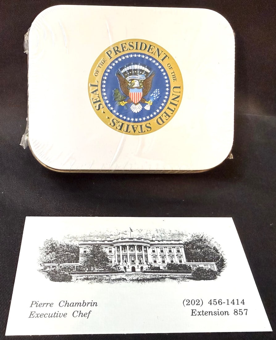 WHITE HOUSE PRESIDENTIAL SEAL CHOCOLATES TIN BY WHITMAN’S, WHITE HOUSE CHEF PIERRE CHAMBRIN ESTATE: An exceptional and highly displayable White House–branded Whitman’s chocolates tin, featuring the iconic Seal of the President of the United States, and originating from the estate of Pierre Chamb
