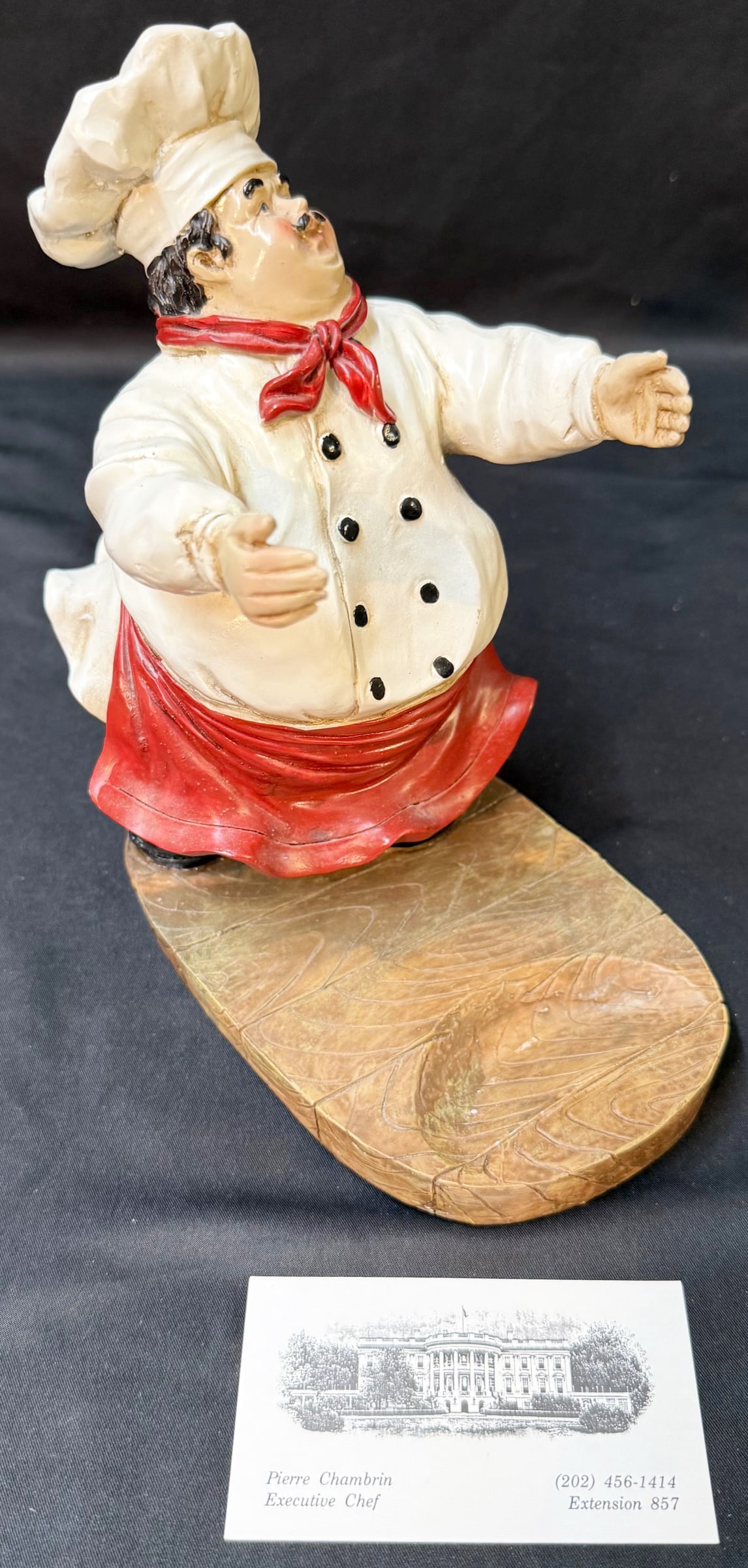 FIGURAL FRENCH CHEF WINE BOTTLE HOLDER, ESTATE OF WHITE HOUSE CHEF PIERRE CHAMBRIN, 4IN x 7IN x 8IN: This is a working-environment object from the estate of former White House Executive Chef Pierre Chambrin—a piece that reflects the culture, humor, and presentation style behind real high-level hosp