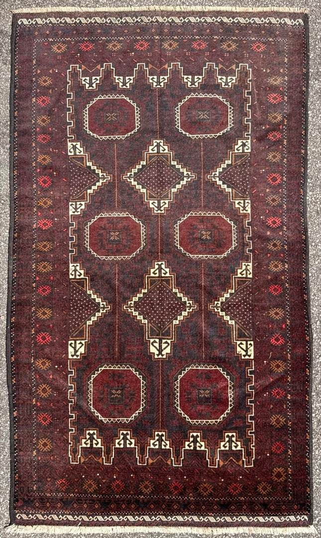 VINTAGE AFGHANI BALOUCH HAND KNOTTED TRIBAL RUG, DARK AUBERGINE AND OXBLOOD GEOMETRIC MASTERPIECE,: An exceptionally refined hand-knotted Afghan Baluch tribal rug showcasing a dramatic palette of deep aubergine, oxblood, espresso, walnut, and ivory. Richly woven with an intricate geometric compositi