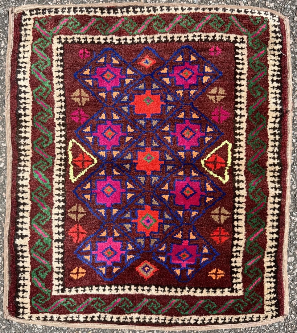 AFGHANI BALOUCH HAND KNOTTED TRIBAL RUG, OXBLOOD, MAGENTA AND ESPRESSO PALETTE, 1.10 x 2.1 (56cm x: An exceptionally decorative hand-knotted Afghan Baluch tribal rug showcasing a dramatic field of deep espresso, oxblood, magenta, and blue tones arranged within a highly architectural tribal compositi