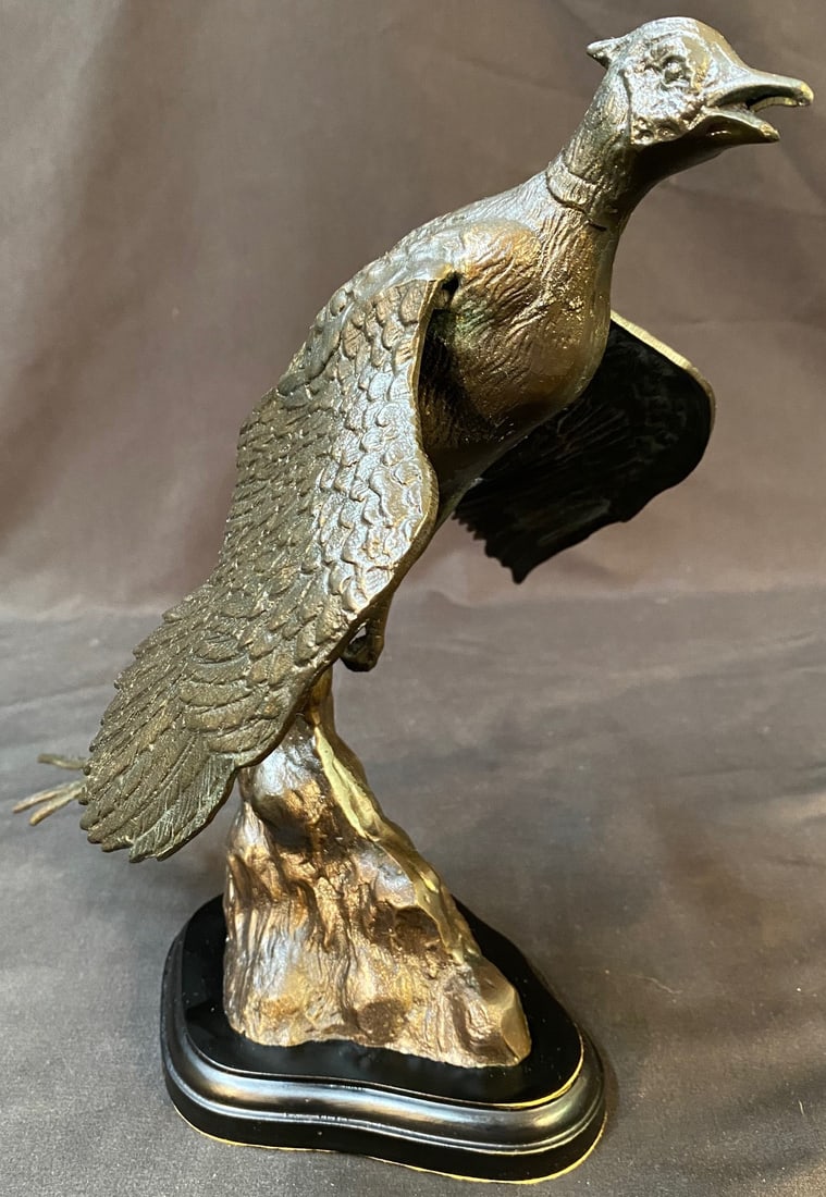 BRONZE STATUE OF A BIRD, 10.75IN (27cm): A bronze statue on a wooden plinth of a bird in flight. This piece was acquired from a Virginia estate and it measures 10.75 in tall. FLAT RATE SHIPPING OF $50.00 WITH INSURANCE FOR THIS PIECE WITHIN 