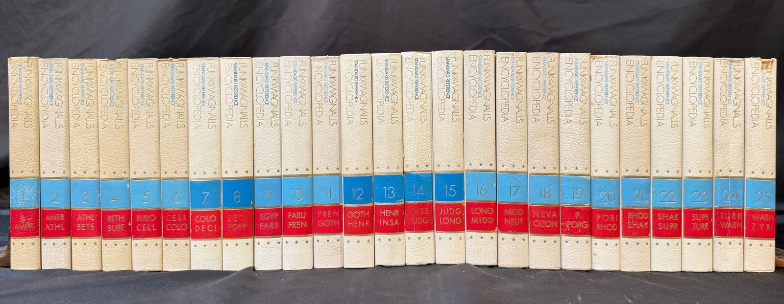 FUNK AND WAGNALLS STANDARD REFERENCE ENCYCLOPEDIA SET, VOLUMES 1-25, 1970: 1970. New York. Simon and Schuster. Very Good+ to Very Good condition. Complete in 25 volumes. This set is the special edition American Presidents Set. White faux leatherette bindings, with blue, red 