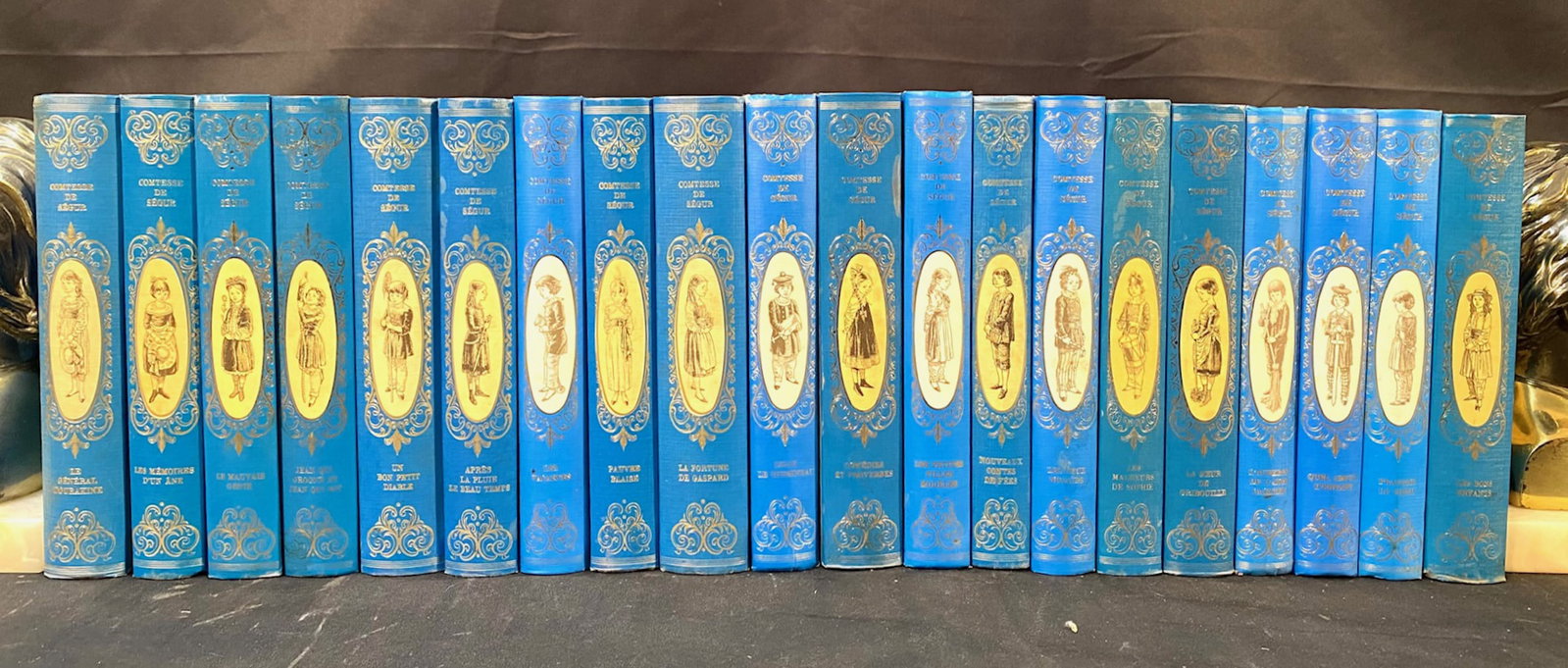 OEUVRE ROMANESQUE LA COMTESSE DE SEGUR, 20 VOLUMES, 1966: 1966. Cercle Du Bibliophile, Publisher. Complete in 20 volumes, all in Near Fine, unread condition. Written entirely in French. All bound in blue, hard cover, with silver and blue embossing on the spi