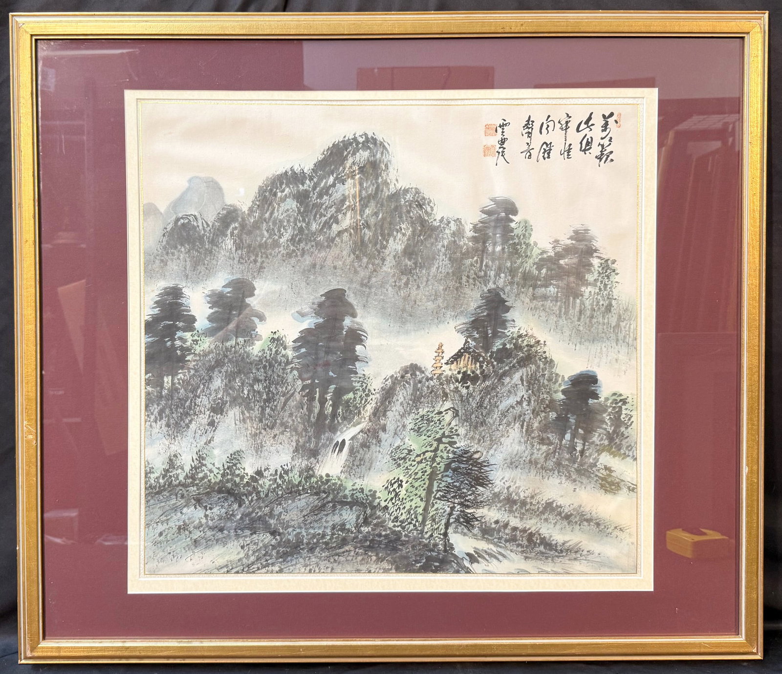 CHINESE INK AND COLOR LANDSCAPE PAINTING SIGNED YUN NONG, 1970s, 29IN x 30.5IN (74cm x 77cm): This atmospheric Chinese landscape depicts layered mountain peaks rising through drifting mist, with expressive pine trees, a cascading waterfall, and a secluded pavilion nestled among the hills. The 