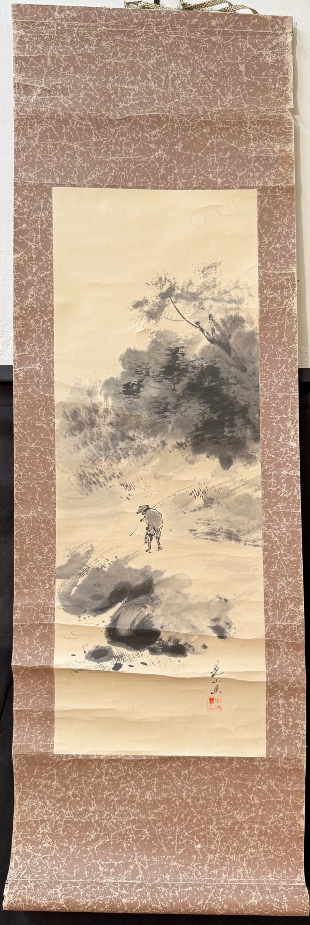 ANTIQUE ORIGINAL JAPANESE SCROLL PAINTING BY KENZAN NAKAMURA OF A LANDSCAPE, 13IN x 38.5IN (33cm x: A Japanese hand painted scroll by Kenzan Nakamura, who was active between 1950-1980. This is a sumi-e landscape painting, and it depicts a lone traveler or farmer walking with a pole by a misty, wind-