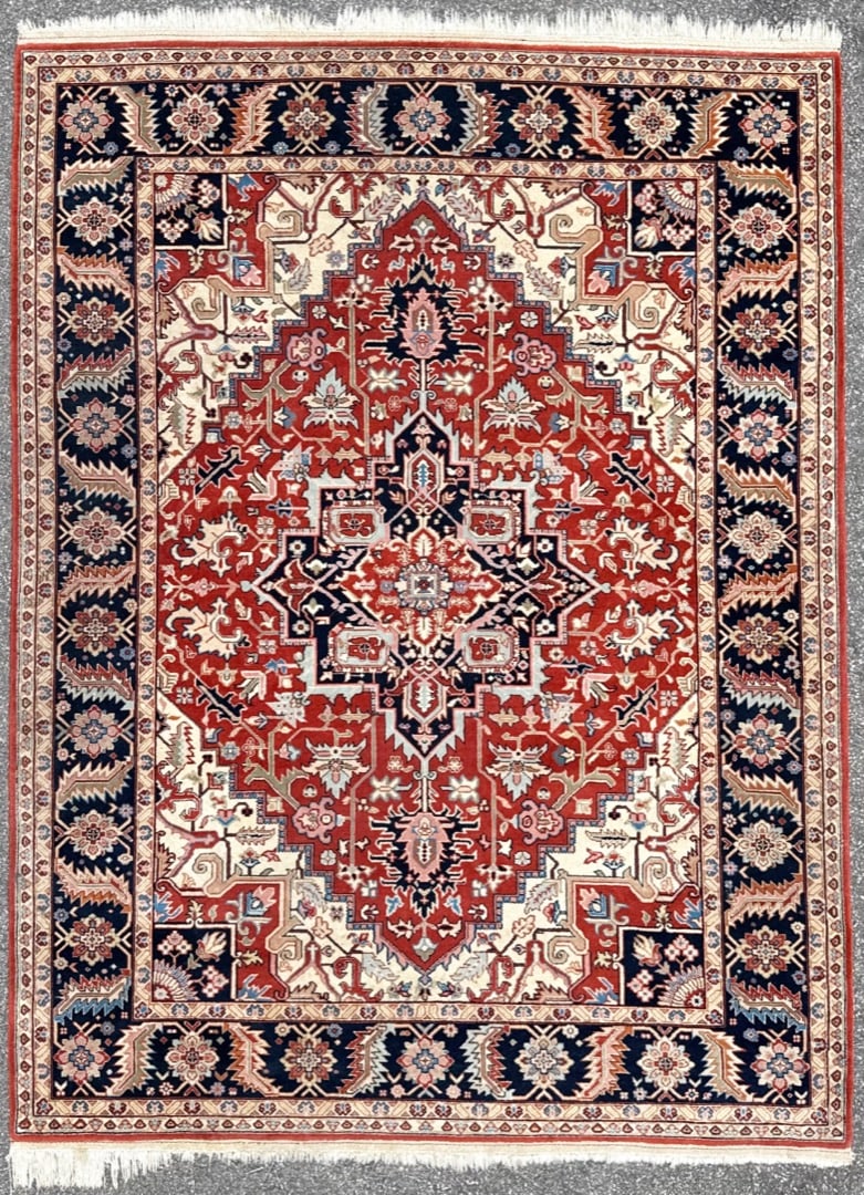 PERSIAN HERIZ HAND KNOTTED RUG, 7.11 x 10.9 (241cm x 328cm): This hand-knotted Persian Heriz rug is the kind of piece that defines a room the moment it is placed. At nearly full room scale, the composition is built around a commanding architectural central meda