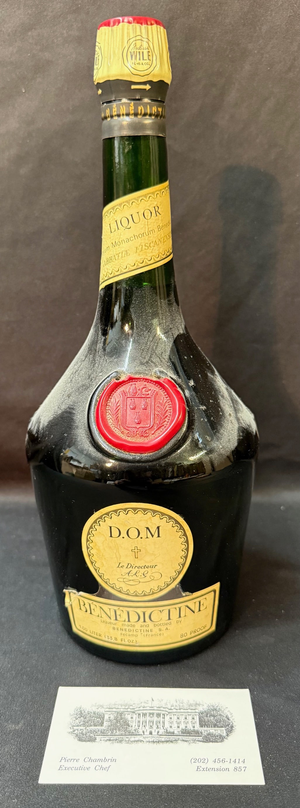 PIERRE CHAMBRIN ESTATE B?N?DICTINE D.O.M. LIQUEUR BOTTLE, WHITE HOUSE EXECUTIVE CHEF PROVENANCE,: A compelling and highly collectible bottle of Bénédictine D.O.M. French herbal liqueur, presented here with exceptional provenance from the estate of Pierre Chambrin, who served as Executive