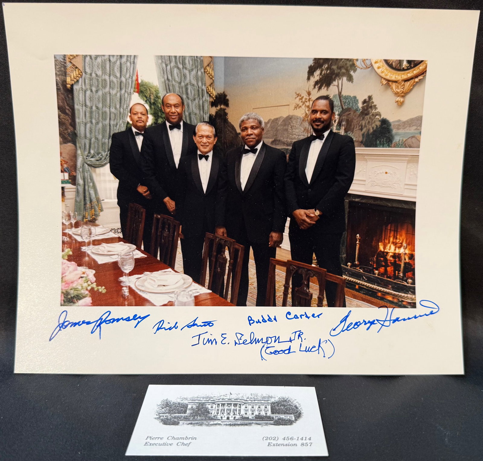 WHITE HOUSE BUTLER STAFF SIGNED PHOTO TO EXECUTIVE CHEF PIERRE CHAMBRIN, EXECUTIVE RESIDENCE: A rare and deeply personal White House Executive Residence artifact, this hand-signed photograph was presented as a retirement gift to Pierre Chambrin, Executive Chef of the White House, by members of