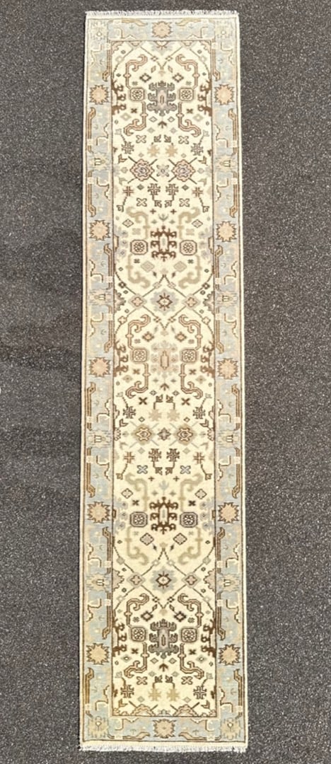 OUSHAK HAND KNOTTED RUNNER, NEW, 2.7 x 11.8 (79cm x 356cm): This Oushak runner was hand knotted in Turkey of 100 percent natural wool on a cotton foundation. The rug has full wool piles and is in brand new condition. Woven in soft ivory, pale sky blu