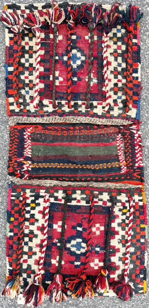 HIGHLY DECORATED PERSIAN TRIBAL SADDLE BAG (KHORJIN), QASHQAI POLYCHROME WOOL, TASSELS & BRAIDED: Offered here is an authentic Persian tribal saddle bag or “khorjin”. This saddle bag is handwoven in wool by nomadic weavers of the Qashqai tribal tradition. This exceptionally v