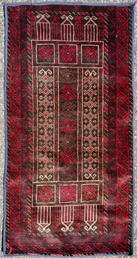 AFGHANI BALOUCH HAND KNOTTED TRIBAL RUG, MOODY OXBLOOD AND ESPRESSO PALETTE, 1.10 x 3.6 (56cm x: An exceptionally decorative hand-knotted Afghan Baluch tribal rug showcasing a dramatic field of deep espresso, oxblood, burgundy, and ivory tones arranged within a highly architectural tribal composi