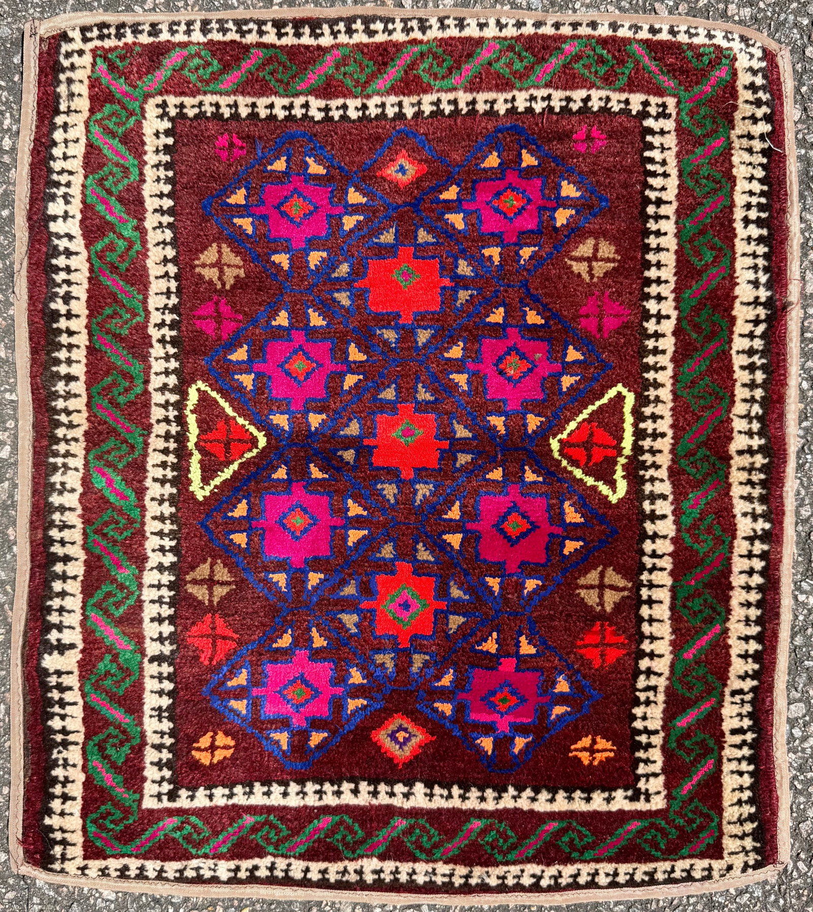 AFGHANI BALOUCH HAND KNOTTED TRIBAL RUG, OXBLOOD, MAGENTA AND ESPRESSO PALETTE, 1.10 x 2.1 (56cm x: An exceptionally decorative hand-knotted Afghan Baluch tribal rug showcasing a dramatic field of deep espresso, oxblood, magenta, and blue tones arranged within a highly architectural tribal compositi