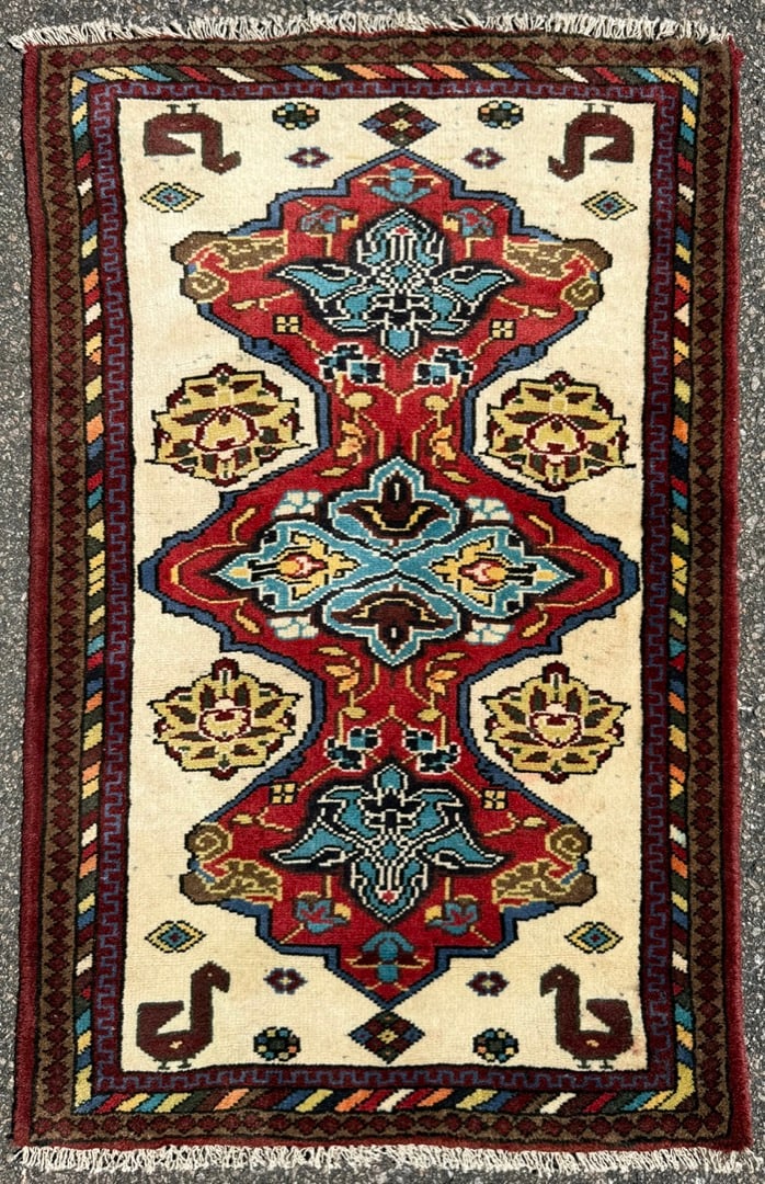 VINTAGE CAUCASIAN KAZAK HAND KNOTTED RUG, 2.6 x 3.10 (76cm x 117cm): Offered is an exceptional hand-knotted, vintage Kazak Caucasian rug featuring a striking ivory field, dramatic geometric medallion, and highly desirable stylized bird motifs. This rug was woven in the