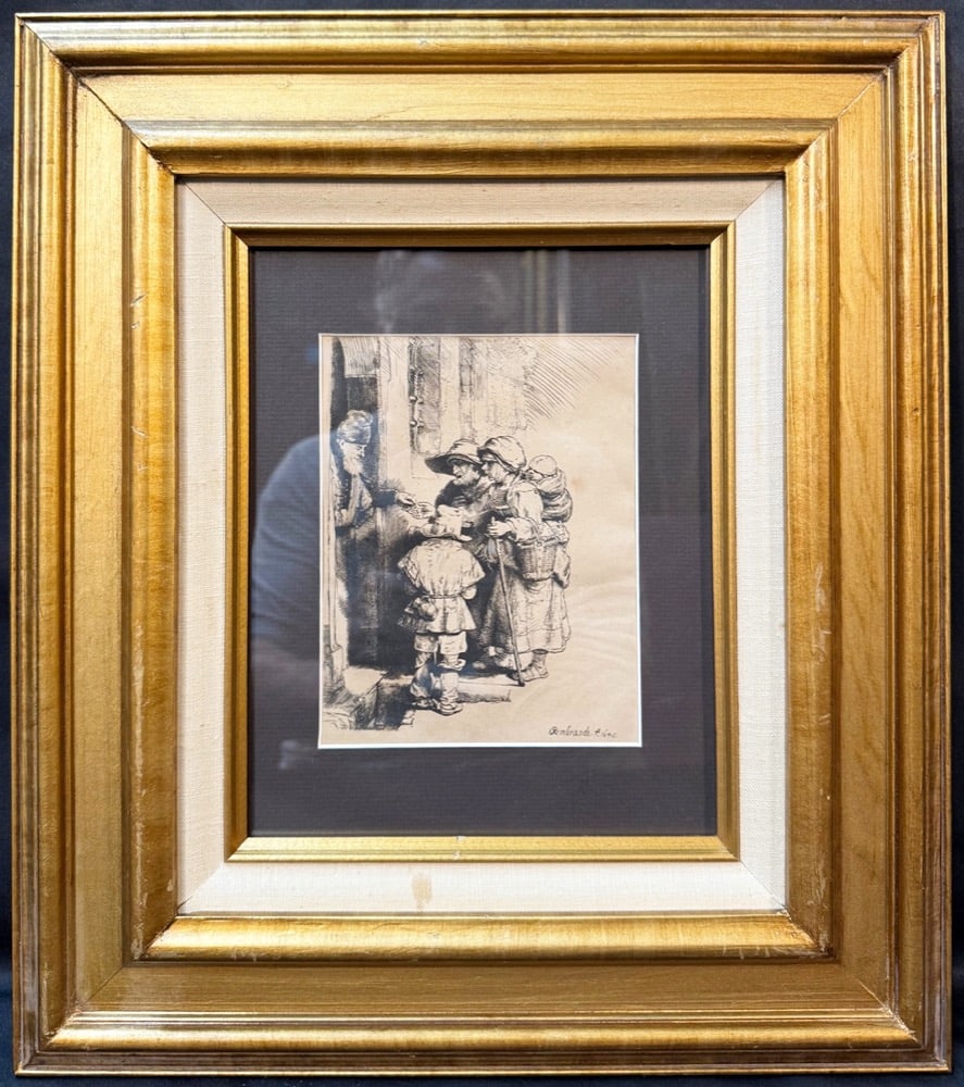 REMBRANDT VAN RIJN (1648) ETCHING TITLED BEGGARS RECEIVING ALMS AT DOOR OF A HOUSE, 15IN x 17IN: A compelling Dutch Golden Age genre scene by Rembrandt van Rijn, capturing one of the artist’s most enduring themes: the quiet, human exchange between wealth and poverty, rendered with emotional