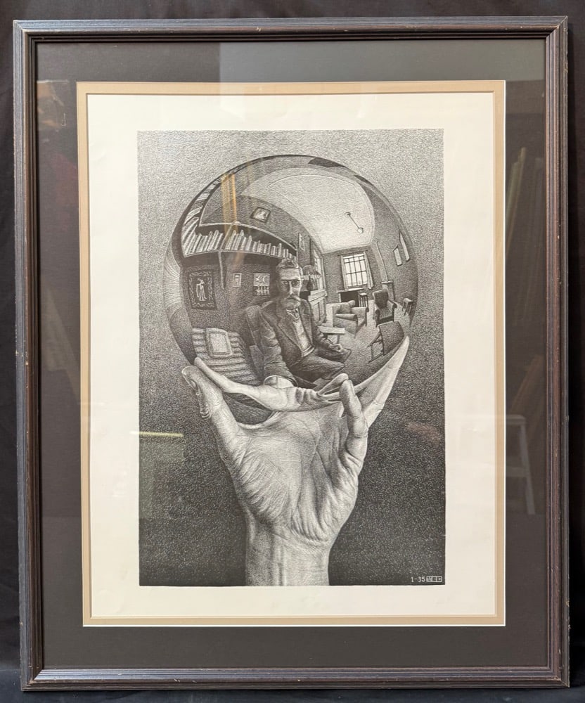 M.C. ESCHER (1898-1972) LITHOGRAPH TITLED HAND WITH REFLECTING GLOBE, 25IN x 30.5IN (64cm x 77cm) (1 of 7)