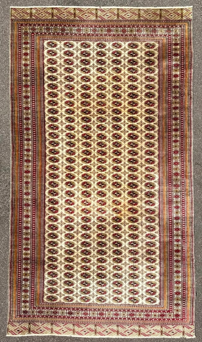 MANSION SIZED, VINTAGE BUKHARA HAND KNOTTED RUG, 9.11 x 16.3 (302cm x 495cm): Offered here is a mansion sized Bukhara Tekke rug that was hand knotted in Pakistan of 100 percent natural wool on a cotton foundation. This rug is 40+ years old, has full wool piles and is in ex
