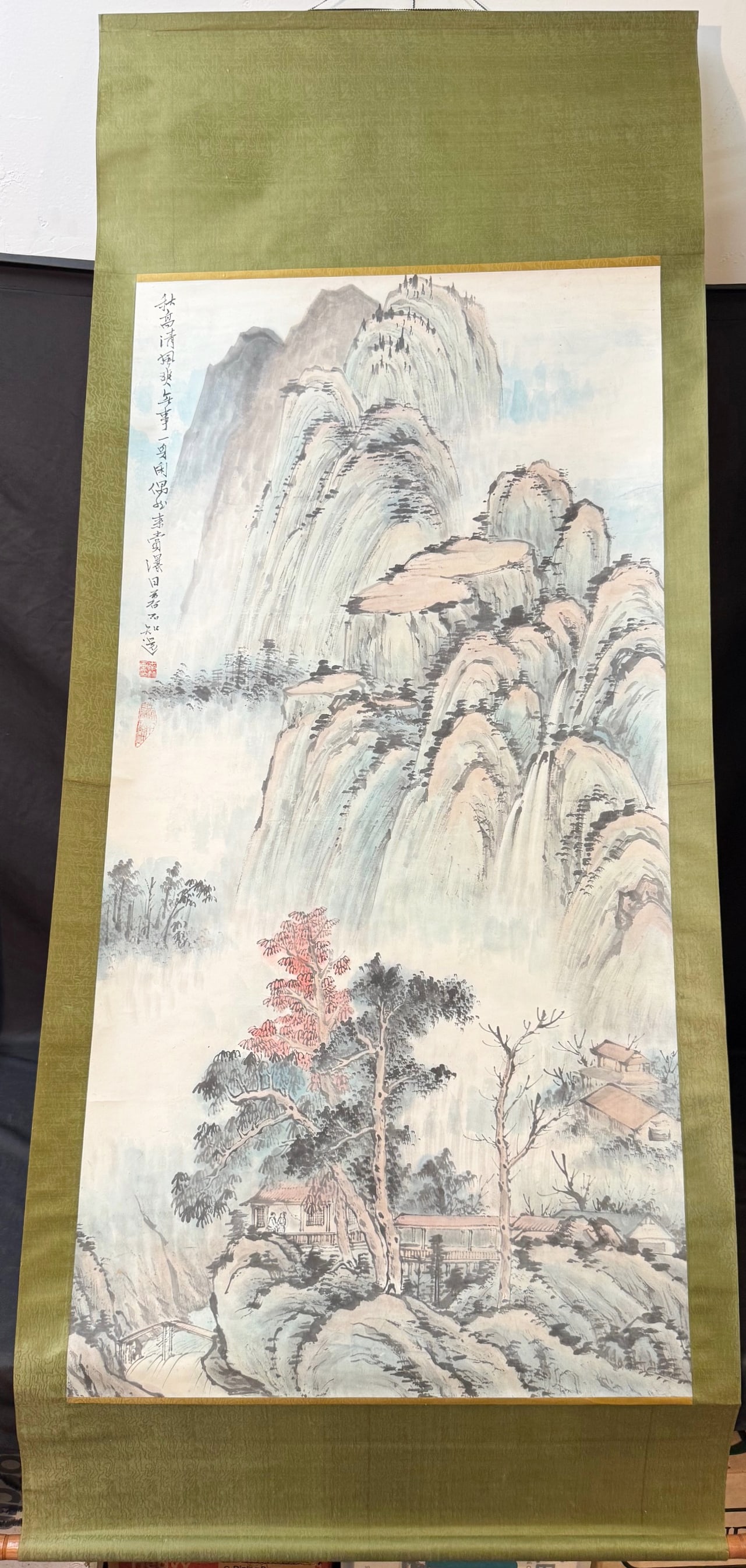 QI BAISHI (1864-1957) CHINESE SCROLL OF MOUNTAINOUS LANDSCAPE, 32IN x 76IN (81cm x 193cm): A Qi Baishi (1864-1957) Chinese scroll of a mountainous landscape with several persons in two different pavilions. With title, seal and chop in the upper, left corner. The entire scroll measures 32 in