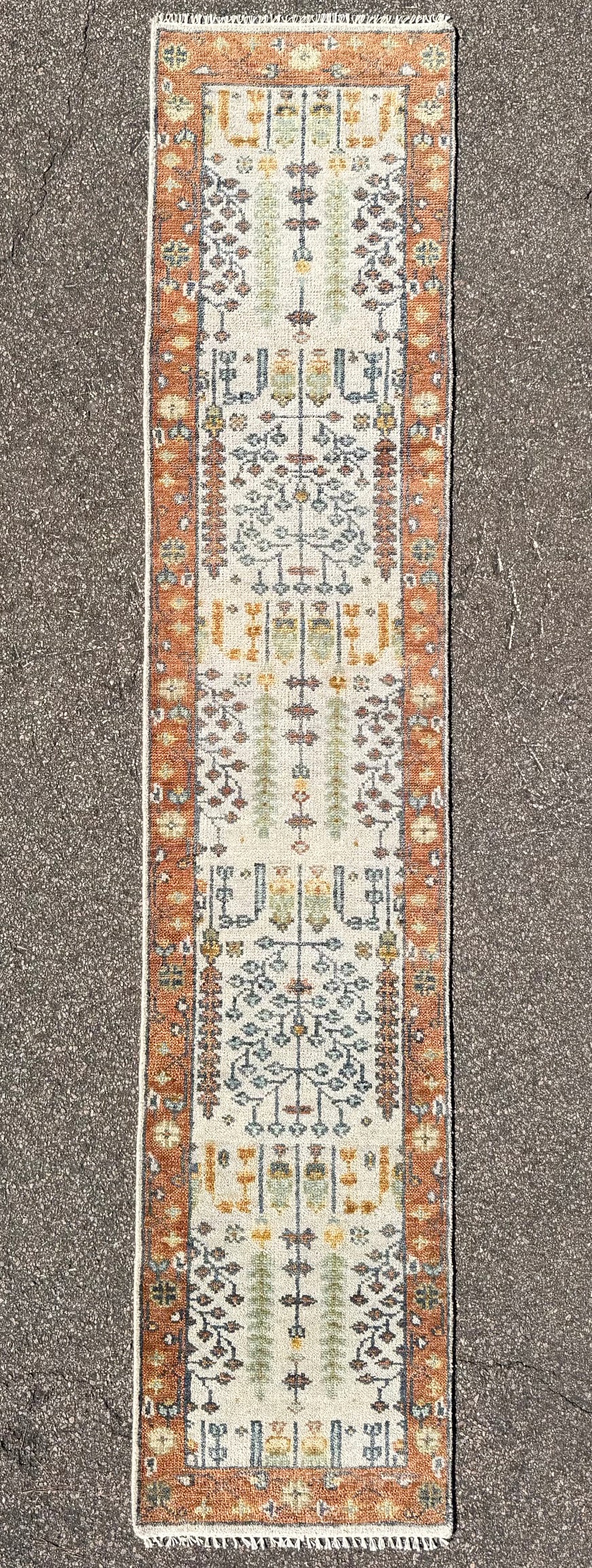 CAUCASIAN KAZAK HAND KNOTTED RUNNER, NEW, 2.6 x 12.0 (76cm x 366cm): Offered here is an unusually long, hand knotted Caucasian Kazak runner that is new and was made in Turkey. The field is an ivory to cream color that is organized into repeating compartments. Within th