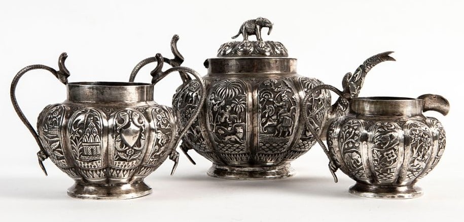 A set of three antique Indian (Kashmiri) silver utensils from the 19th century, unmarked, made of: A set of three antique Indian (Kashmiri) silver utensils from the 19th century, unmarked, made of sterling silver, decorated with hand-chasing, total weight: 1,035 grams, height of the teapot: 16 cm,