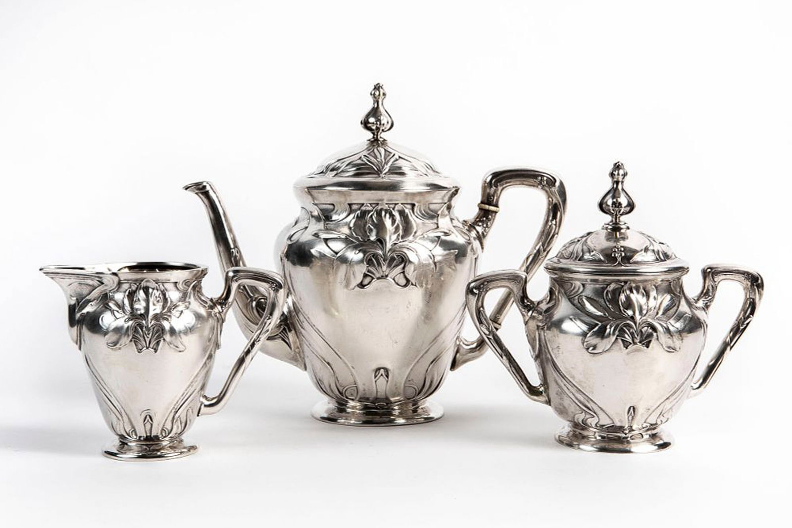 German Art Nouveau silverware set, circa 1900, three pieces including: a teapot, a sugar bowl and a: German Art Nouveau silverware set, circa 1900, three pieces including: a teapot, a sugar bowl and a milk jug, made of 800 silver, stigned by the manufacturer 'Bruckmann & S?¶hne, Heilbronn', total we