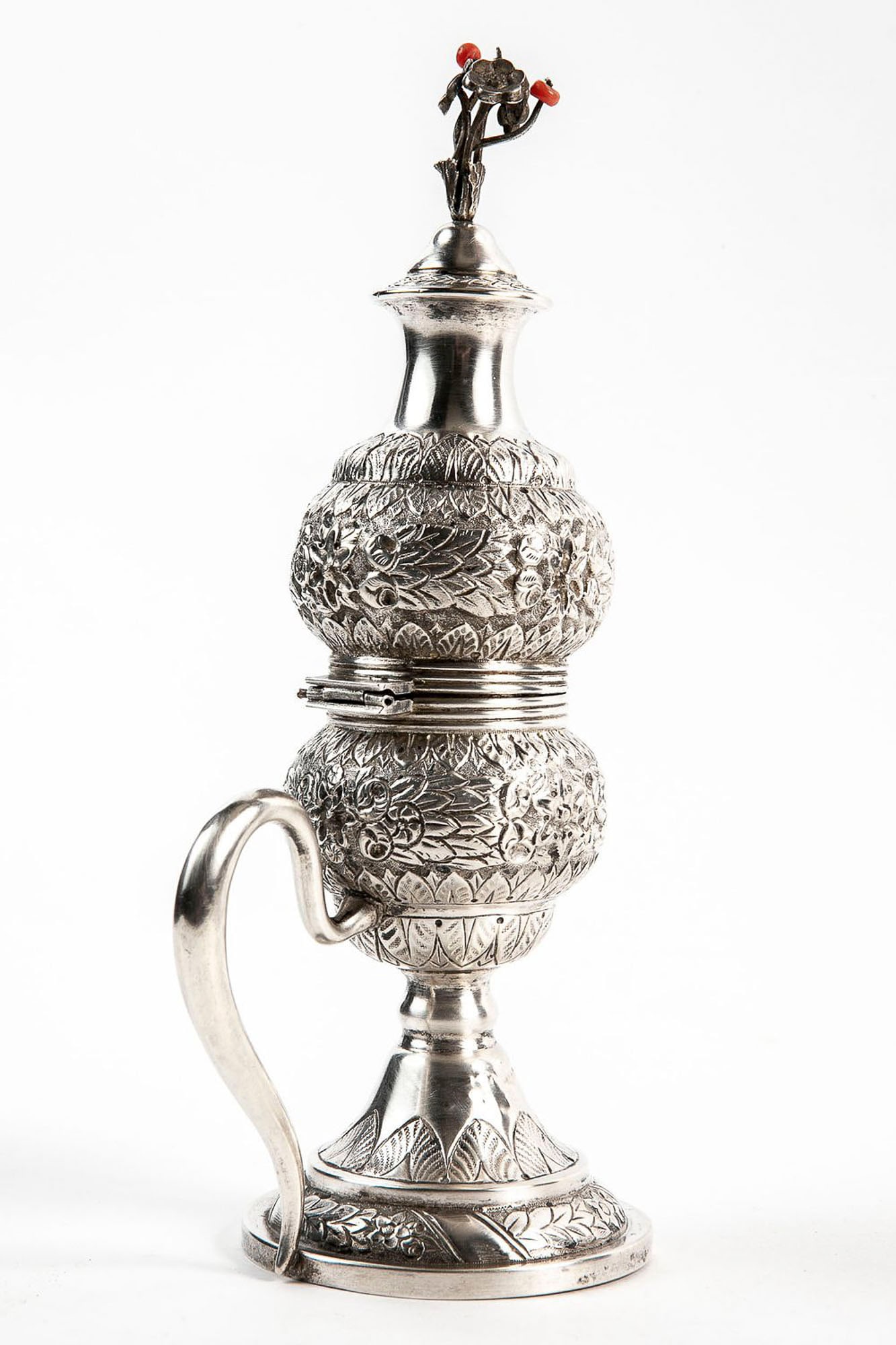 An antique Tunisian Havdalah vessel, made of silver, hand-hammered in Repousse work, the lid is set: An antique Tunisian Havdalah vessel, made of silver, hand-hammered in Repousse work, the lid is set with coral beads, a carrying handle, signed Roussel (from the period when Tunisia was under the prot