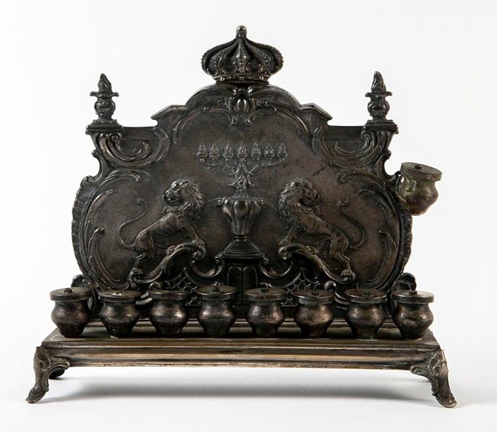 An antique German Hanukkah lamp, made by W.M.F., made of metal, silver plating residue, hallmarked (1 of 9)