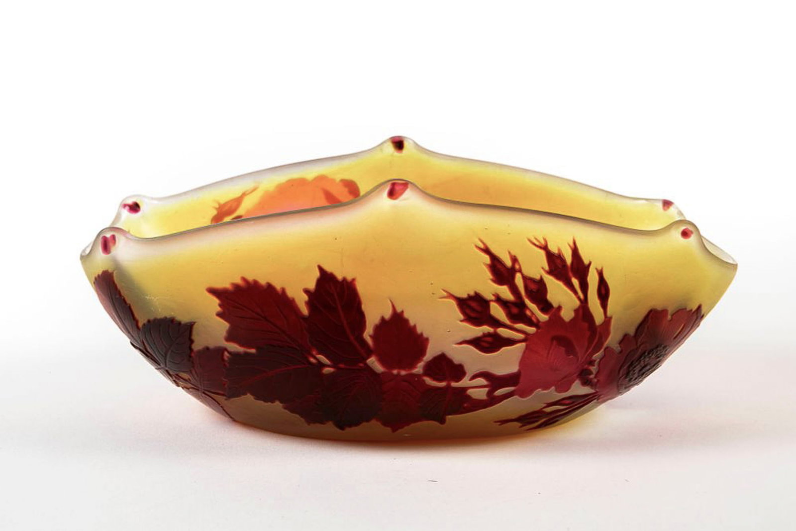 An antique French Art Nouveau glass bowl, made by Emile Galle, decorated and marked with cameo,: An antique French Art Nouveau glass bowl, made by Emile Galle, decorated and marked with cameo, layered in shades of red on a yellow background, Height: 9 cm, Width: 14 cm,
