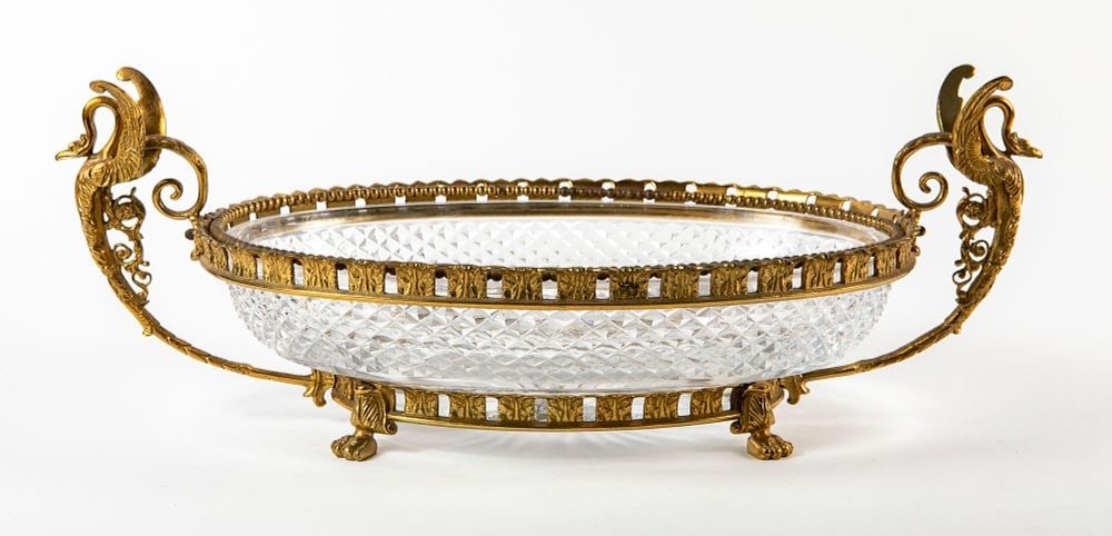 An antique and luxurious French centerpiece, made by Baccarat, hand-polished diamond-patterned: An antique and luxurious French centerpiece, made by Baccarat, hand-polished diamond-patterned crystal, Empire-style gold-plated bronze devices, swan-shaped handles and animal-claw-patterned four-legs