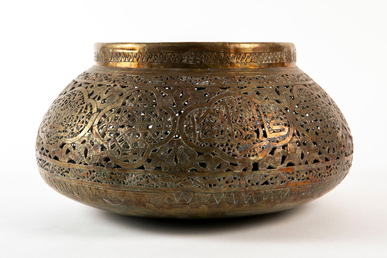 An antique Syrian vessel, made of brass, decorated with hand-sawn work, Height: 14.5 cm, diameter: (1 of 3)