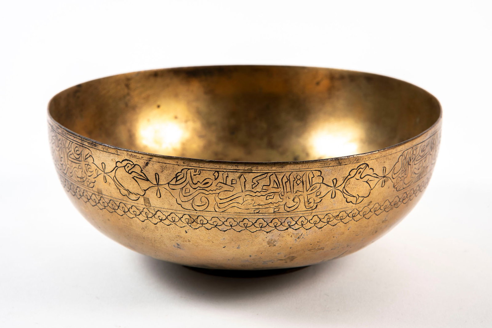 An antique Islamic bowl, made of brass, decorated with an inscription and figures of birds, Height: (1 of 5)