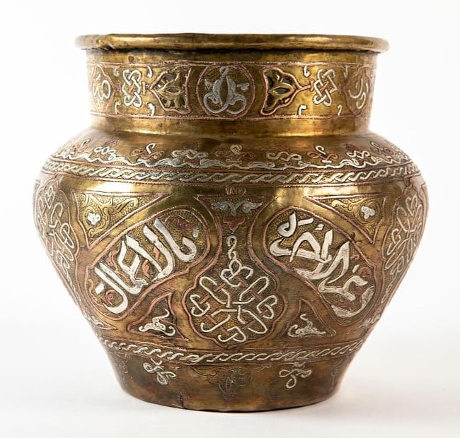 An Islamic vessel, decorated with Damascus work, the upper part is decorated with hand-sawn work, (1 of 4)