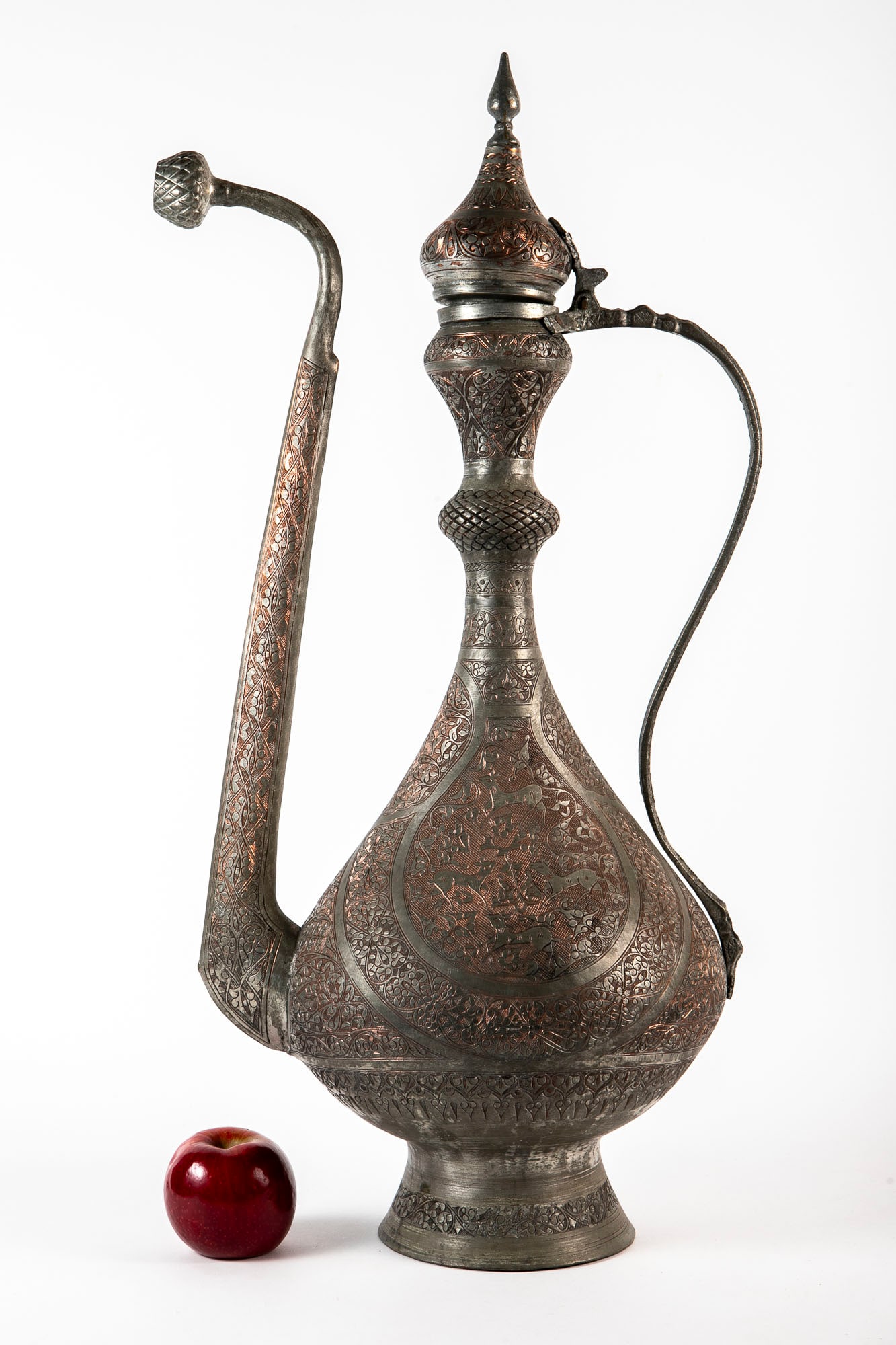 A large Persian Islamic floor jug, made of copper, hand-decorated with an animal model and a (1 of 5)