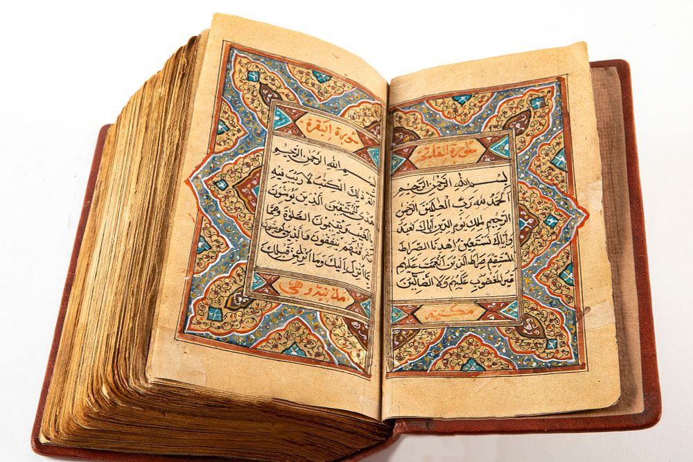 An antique 18th-century Quran, hand-painted and handwritten, bound in an old binding, repairs, (1 of 6)