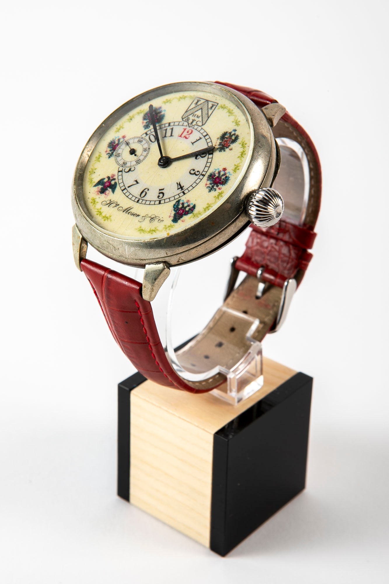 A pocket watch made of metal that was converted into a wristwatch, made by Moser, mechanical: A pocket watch made of metal that was converted into a wristwatch, made by Moser, mechanical movement, porcelain dial painted in enamel, working condition not tested, Diameter: 55 mm.