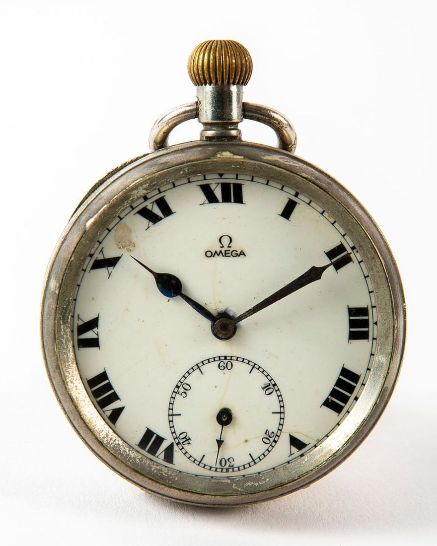 An antique pocket watch from the beginning of the 20th century, made by Omega, made of metal, small: An antique pocket watch from the beginning of the 20th century, made by Omega, made of metal, small defect to the plate, working condition not tested, Height including rack: 7 cm, diameter: 4.5 cm,