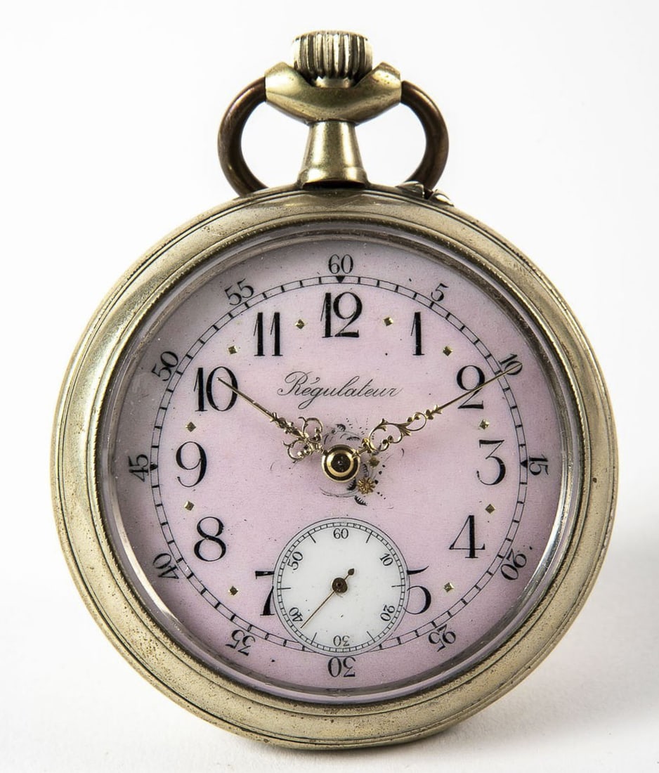 A large pocket watch, made of steel and a pink enamel painted dial, probably French, working: A large pocket watch, made of steel and a pink enamel painted dial, probably French, working condition not tested, Height including the rack: 10 cm, diameter: 7 cm,