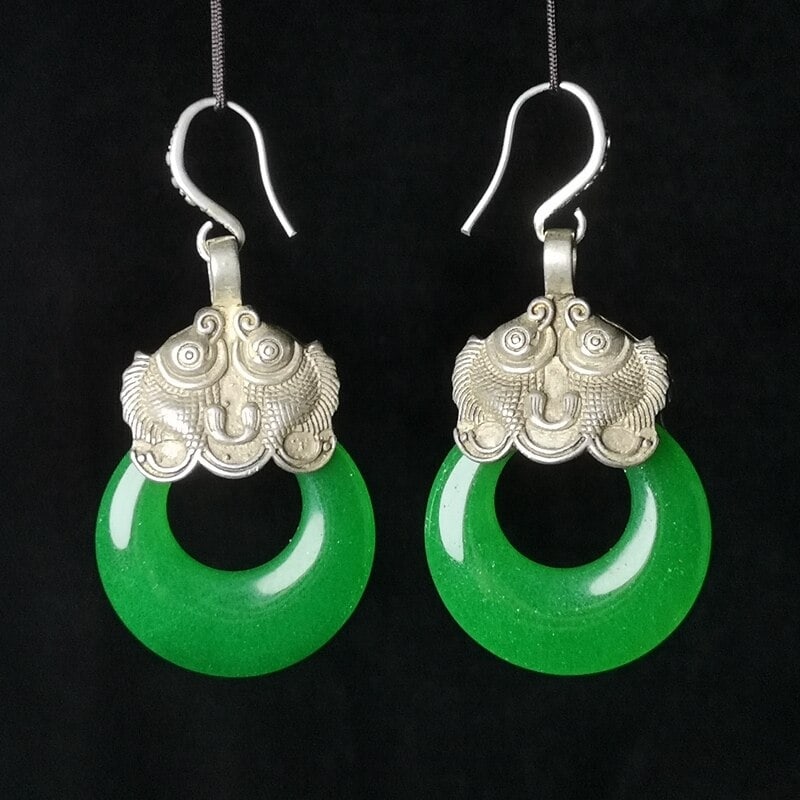 Elegant Chinese Tibet Silver Fish Earrings Jade: Size: Height 6 cm - Width 3 cm - Thickness 1.3 cm. Weight 24 g (pair). Materials: Jade, Tibetan silver (alloy of tin with copper or zinc). Condition: It has a look from a bygone era. Exquisite old-sty