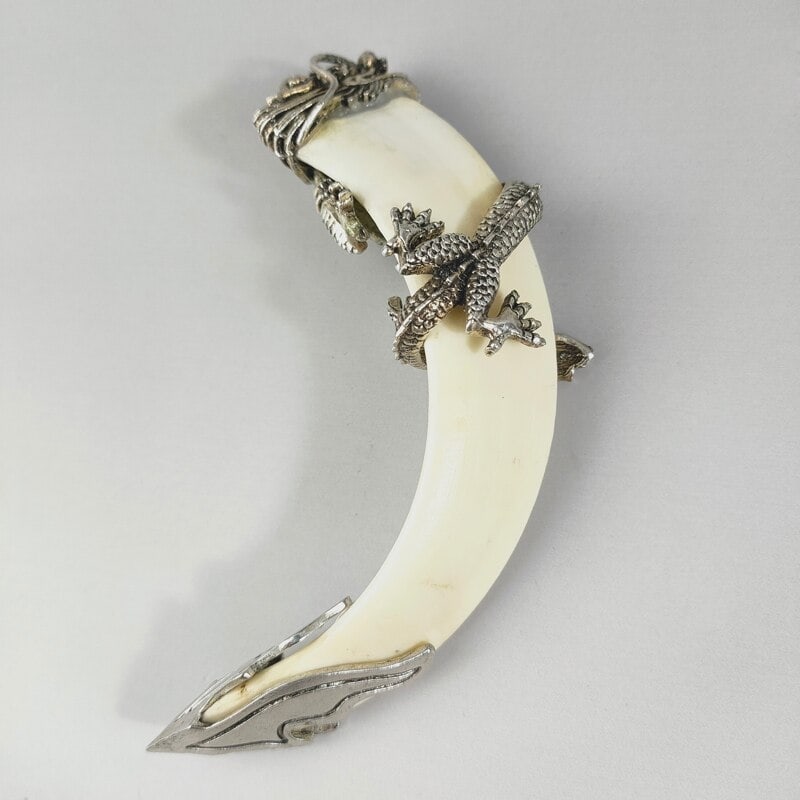 Elegant Chinese Handmade Fang Pendant Boar Teeth: Size: Height 12.8 cm. Weight 80 g. Materials: Tibetan silver (alloy of tin with copper or zinc), wild boar teeth. Condition: Excellent.Appears to have a classic aesthetic. This exquisite pendant featu