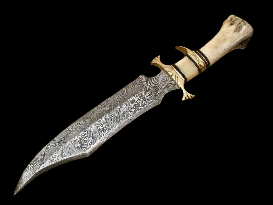 Unique Handmade Bowie Hunting Knife Bone Handle: Size: Overall Length 38.1 cm - Blade Length 22.86 cm - Handle Length 15.24 cm. Materials: Damascus steel, camel bone Condition: New. Leather case included. This handmade, hand-forged Damascus steel Bo