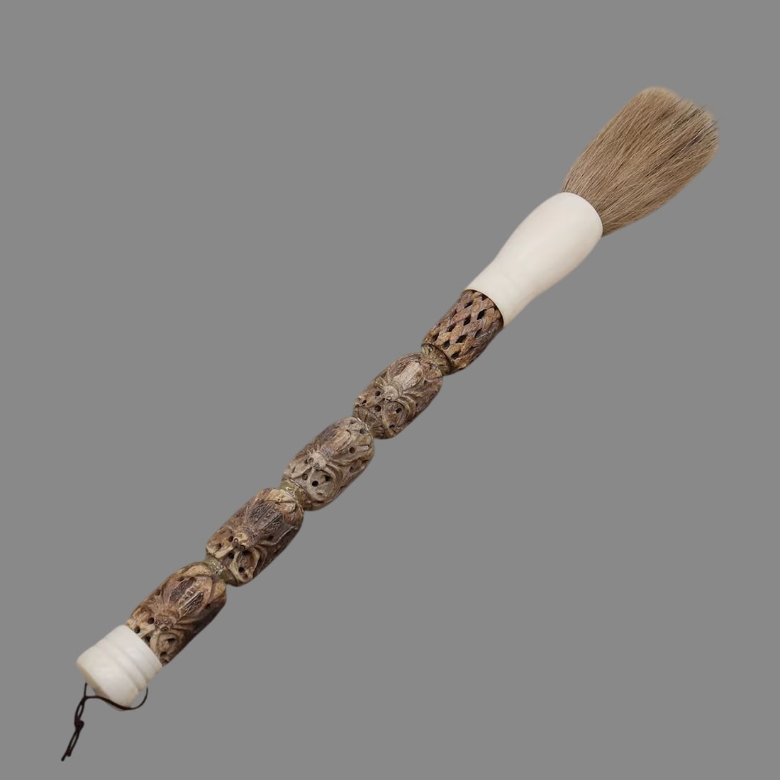 Buffalo Bone Brush Carved Handle Geometric Motifs: Size: Length 36 cm - Width 2.8-3 cm. Materials: Buffalo bone. Condition: Appears to have a classic aesthetic. This vintage-style calligraphy brush features a carved buffalo bone handle, intricately de